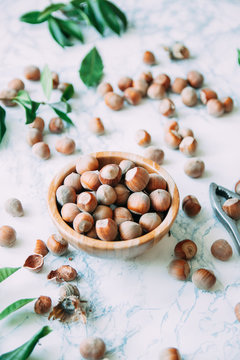 Overhead shot of hazelnuts on a marble background
