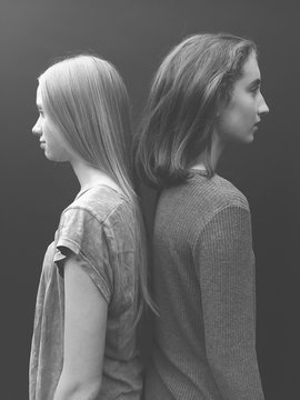 Portrait of two teenage girls, facing away