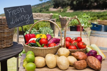 Various fresh vegetables with placard arranged on table