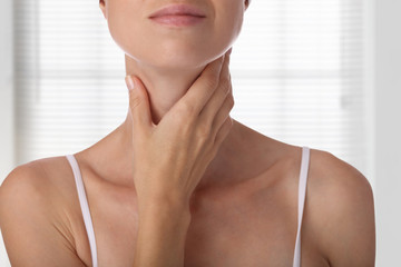 Fototapeta na wymiar Woman thyroid gland control