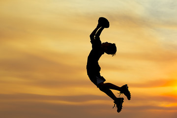 Fototapeta premium Boy leaps for the ball.