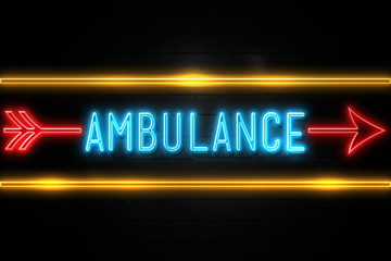 Fototapeta premium Ambulance - fluorescent Neon Sign on brickwall Front view
