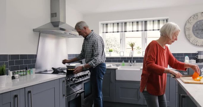 Elderly Couple in the Kitchen Cooking