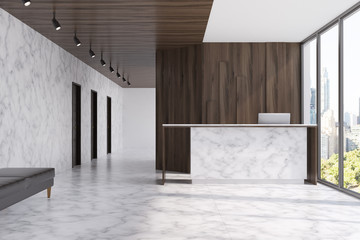 Marble reception in a dark wood office