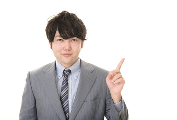 指示する笑顔のビジネスマン