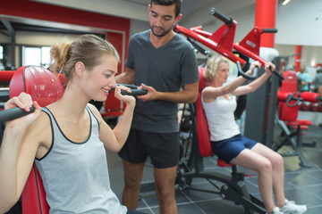people training at the gym club
