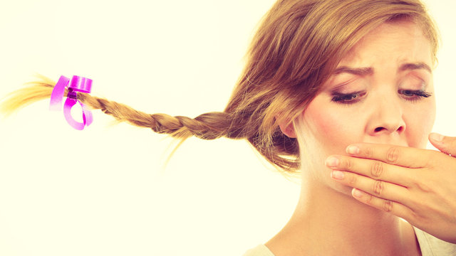 Sad teenage girl in windblown braid hair