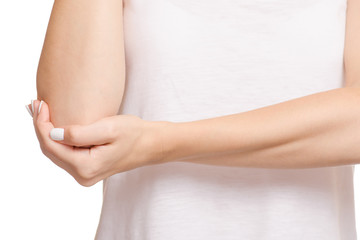 Fototapeta na wymiar Female hand hurts the elbow of a hand