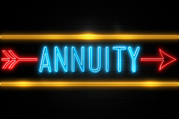 Fototapeta premium Annuity - fluorescent Neon Sign on brickwall Front view