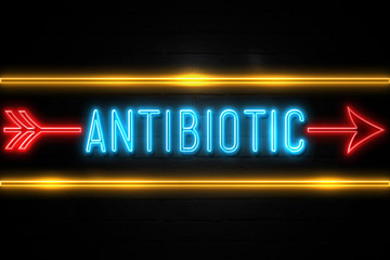 Obraz premium Antibiotic - fluorescent Neon Sign on brickwall Front view