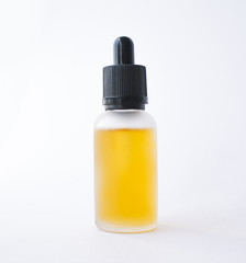 Vape bottle with orange liquid mockup