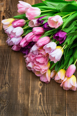Close up of Bunch of Colorful Tulips on Wooden Background