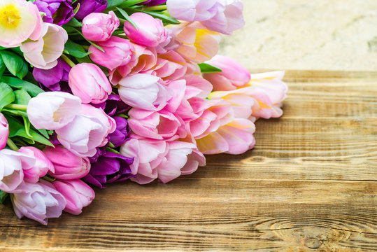 Close up of Bunch of Colorful Tulips on Wooden Background