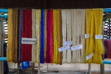 Obraz premium Colored silks hang from pipe in Siem Reap, Cambodia