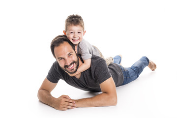 Father and son having fun over white background