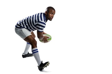 Full length of young athlete playing rugby