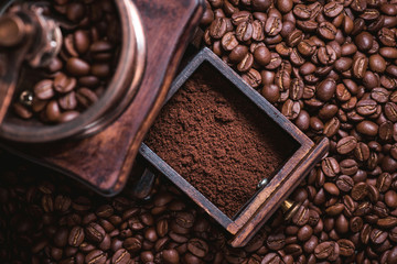 Grinding coffee from fresh roasted coffee beans.