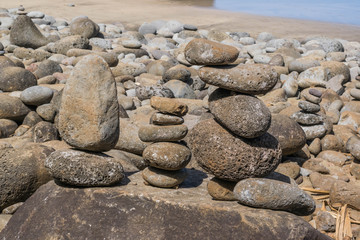 Fototapeta na wymiar Close up of stacked rocks on the beach