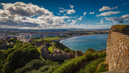 A wide angle shot of the Scarborough Castle, beach and old town in North Yorkshire, England, UK by...