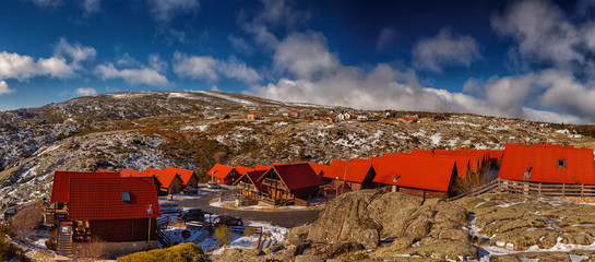 A panoramic shot of a wintry landscape in Serra da Estrela, Covilha, Portugal