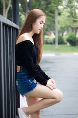 Portrait of thai adult beautiful girl relax and smile