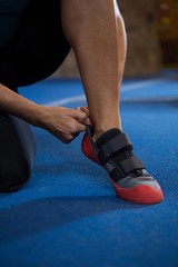 Woman wearing shoes in gym