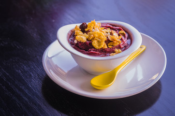 Delicious açaí bowl with granola. Typical Brazilian food.