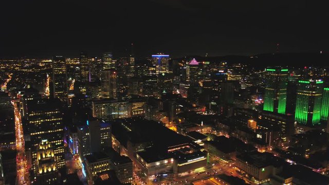 Montreal Quebec Aerial v41 Flying over downtown waterfront area panning with cityscape views at night