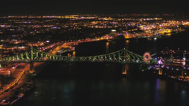 Montreal Quebec Aerial v47 Flying over St Lawrence river with Jacques Cartier Bridge views at night