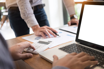 business partners discussing documents and ideas plans to his colleagues at meeting at workspace office