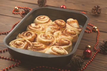Raw cinnamon rolls. Preparation process - unbaked dough, waiting befor baking, new year atmosphere