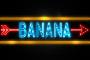 Fototapeta premium Banana - fluorescent Neon Sign on brickwall Front view