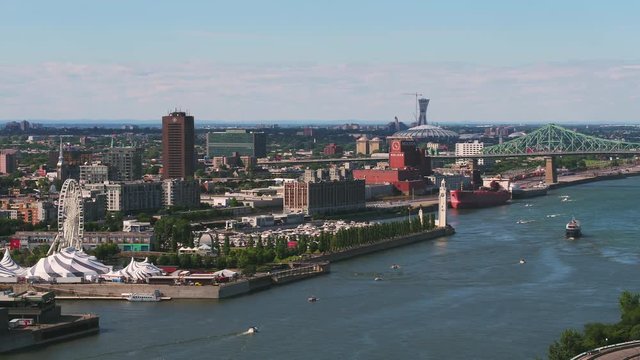 Montreal Quebec Aerial v55 Flying low over St Lawrence river panning with waterfront views