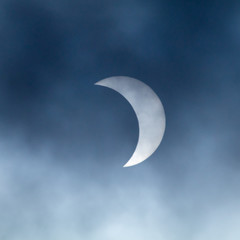 Obraz na płótnie Canvas The Great American Eclipse. Captured in Marion, KY with partial cloud cover.