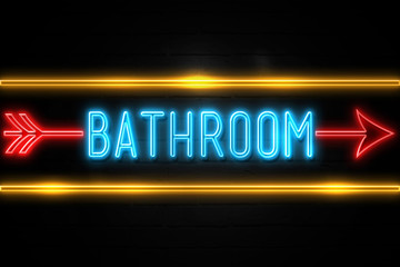 Bathroom  - fluorescent Neon Sign on brickwall Front view