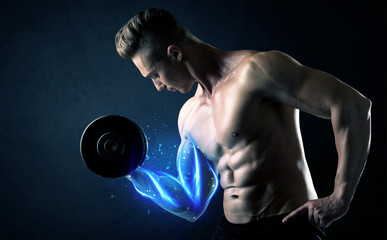 Obraz na płótnie Canvas Fit athlete lifting weight with blue muscle light concept