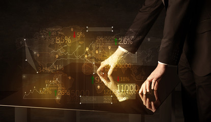 Hands navigate on high tech smart table with business icons