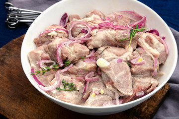 Marinated raw pork kebabs.