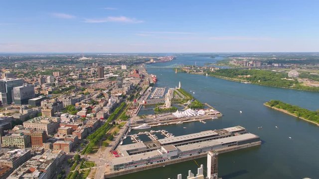 Montreal Quebec Aerial v69 Flying over waterfront area panning with river and city views