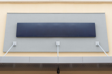 Large blank billboard on a street wall, banners with room to add your own text