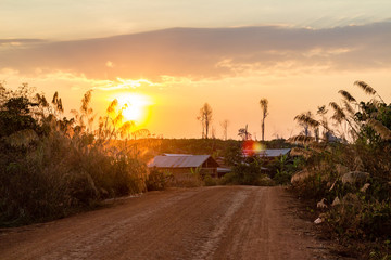 Obraz premium Red ground and dust on the rural road in Cambodia