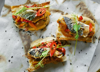 Delicious molletes with fillet of fish and vegetables on plate