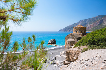 Agios Pavlos beach with Saint Paul church, a very old Byzantine church that was built at the place Selouda, an incredible beach at Opiso Egiali area.