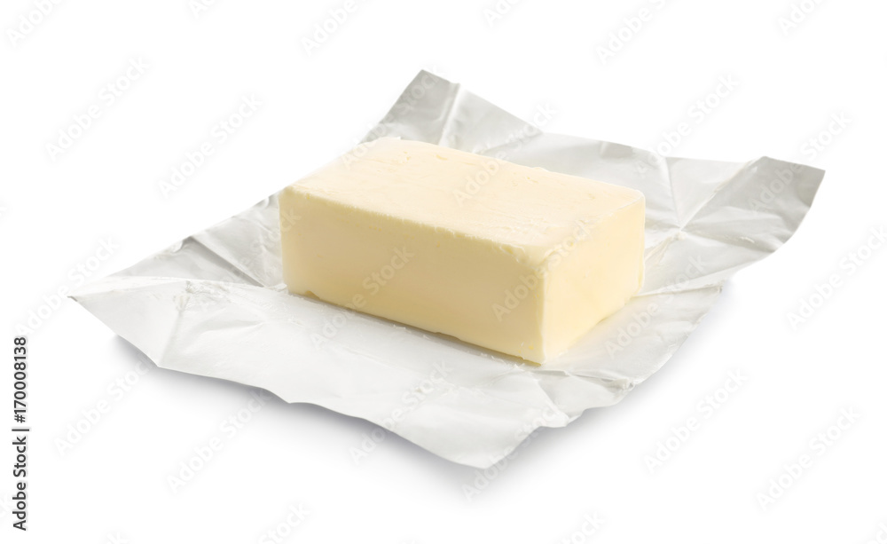 Aufkleber whole block of butter in open foil packaging isolated on white