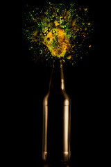 a bottle of beer  with spray