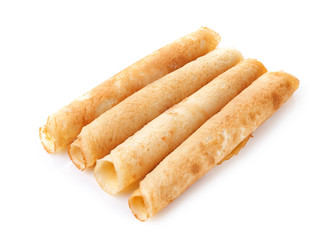 Rolled thin pancakes isolated on white