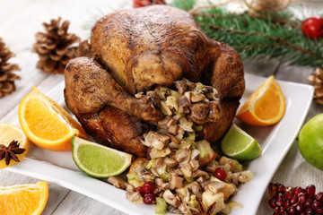 Fototapeta na wymiar Roasted turkey with stuffing served on holiday table