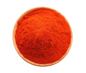 Red chili powder in wooden plate isolated on white, top view