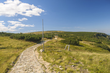 Stone path in the mountains which is road for tourists and hikers