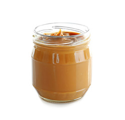 Jar with creamy peanut butter on white background